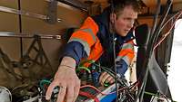 Peter Fritzen checks a driving robot