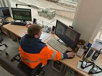 Man in front of a computer at a desk