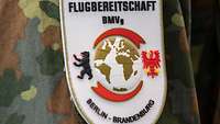 Auf dem neuen Patch sind neben einer Weltkugel unter anderem der Berliner Bär und der Brandenburgische Adler abgebildet.