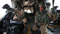 View of the inside of an NH-90 Chase. Door gunners operate their automatic cannons.