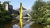 An office building behind a pond