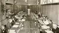 Participants of the 1972 Conference of Commandants sitting around a large conference table