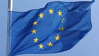 The EU flag is waving in the wind.