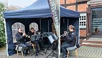 Ein Quintett von Blechbläsern inUniform sitzt unter einem Pavillon und spielt weihnachtliche Melodien.