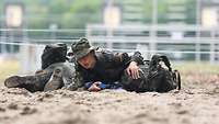 It is crawled over the sand. It's called gliding in the Bundeswehr