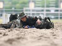 It is crawled over the sand. It's called gliding in the Bundeswehr