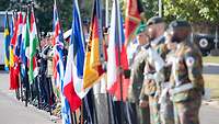 Soldiers are holding the Flags of den Nations of MMCC/EMC