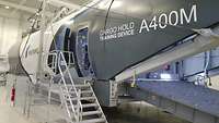 Aircraft fuselage-shaped simulator