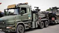 A Belgian heavy equipment transporter is carrying a Marder infantry fighting vehicle.