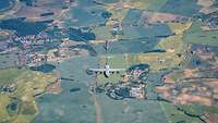 An A400M, eight fighter jets and a B1 fly over German farmland.