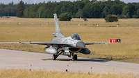 An F-16 fighter jet of the Greeks taxis on the Lechfeld.