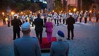 A military orchestra’s performance; audience in the foreground