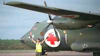 A German soldier marshals a Transall C-160.