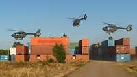 Soldiers rappelling from H145M onto containers