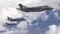 Three Dutch F-35 jets during in formation flight.