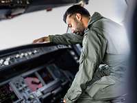 Technician in the cockpit of the A330 MRTT.