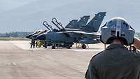 Several Tornado fighter jets are lined up at Elmendorf Air Force Base in Alaska.