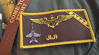 A soldier's name tape can be seen with the callsign "Jiji".