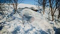 Only a white hillock indicates that a concealed position has been dug into the snow.